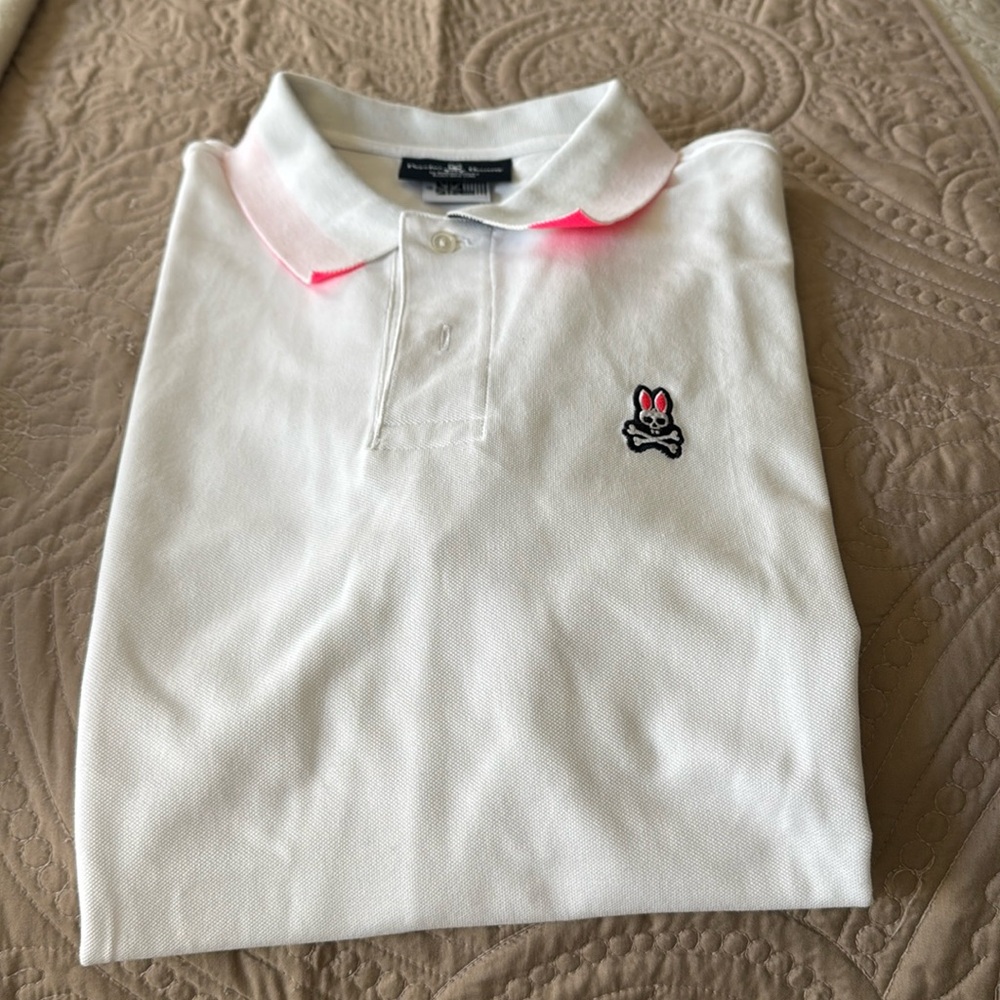 Psycho Bunny Polo. White with pink, blue, white under collar. New, never worn.